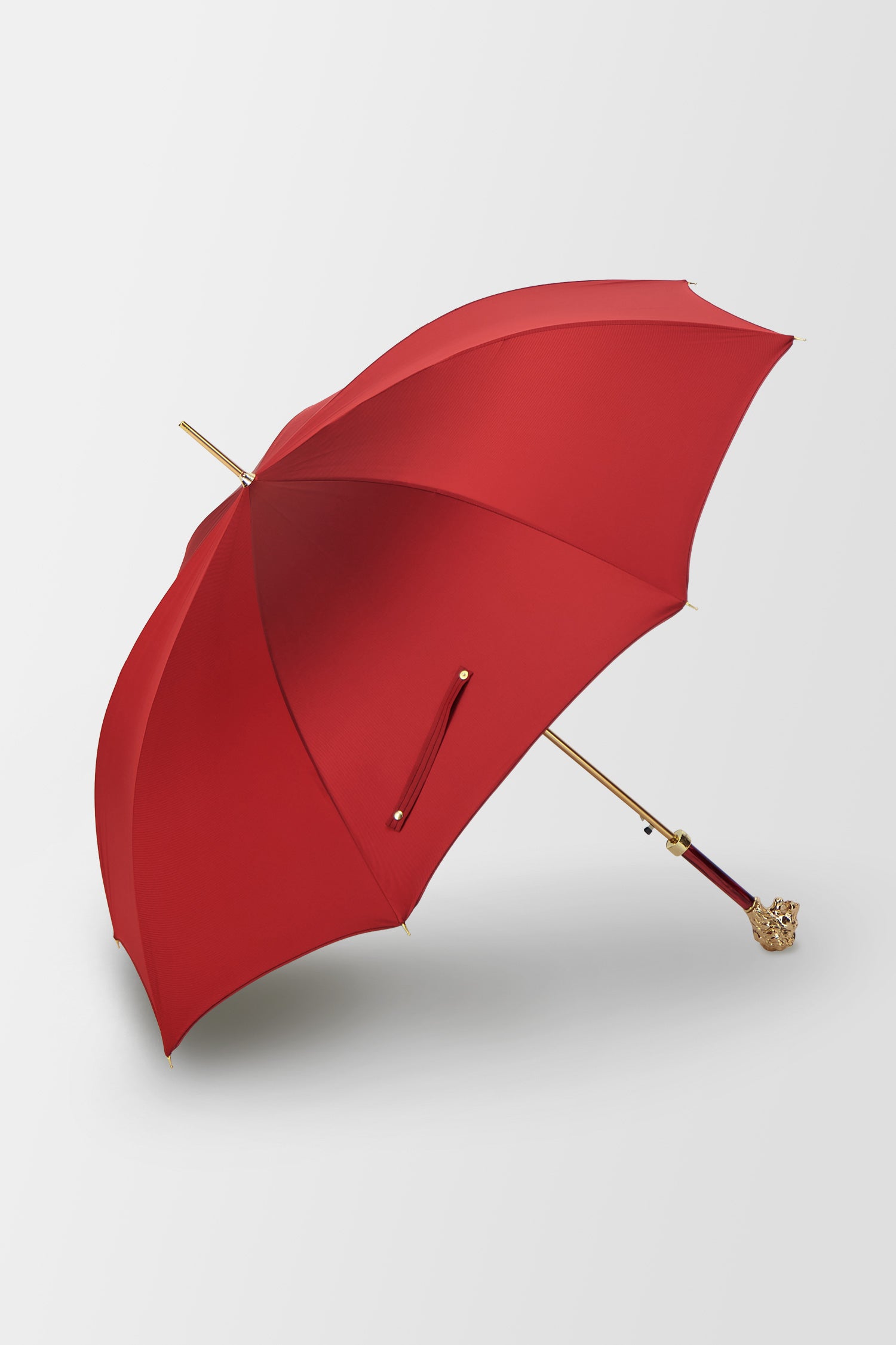 Parapluie rouge Pasotti avec poignée tête de lion dorée, avec étui et anneau